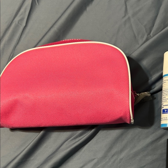 Vibrant Pink Toiletry Bag with Zipper and travel items. - Picture 2 of 14